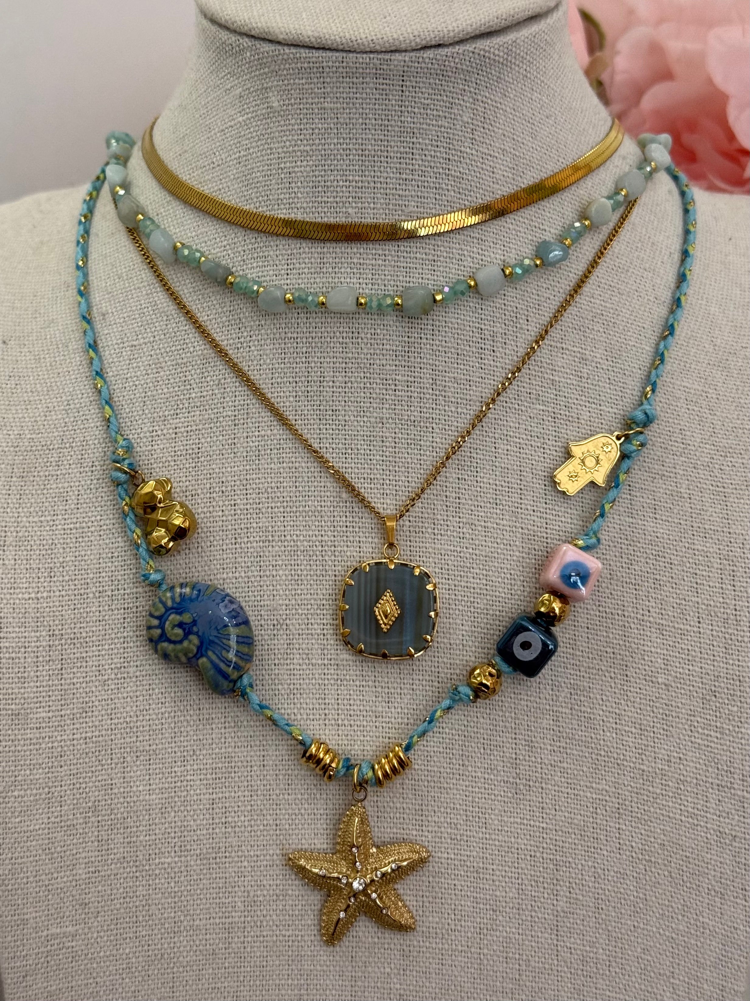 Collana multi charm stella marina corda azzurra