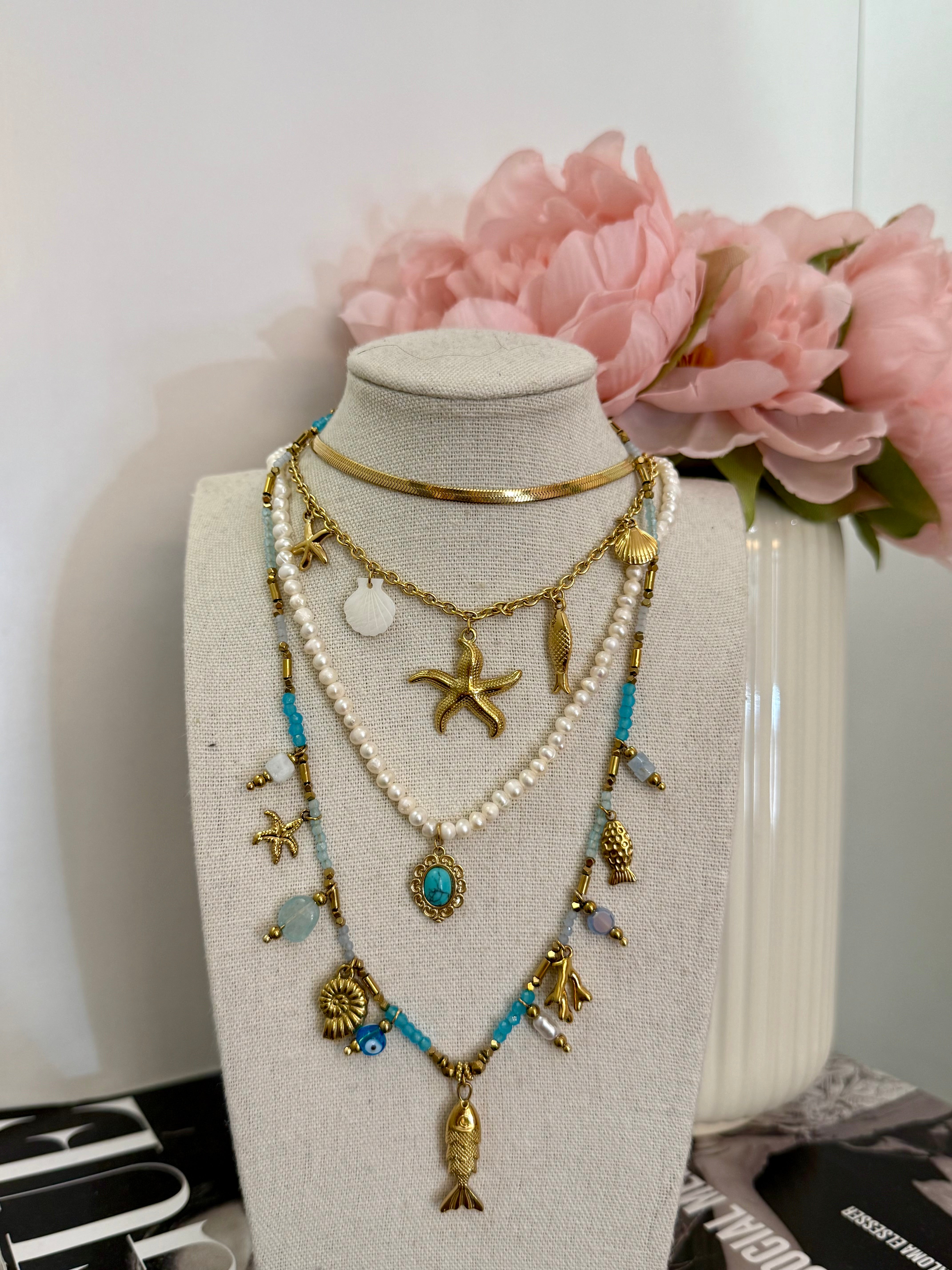 Collana multi charm stella marina e conchiglie
