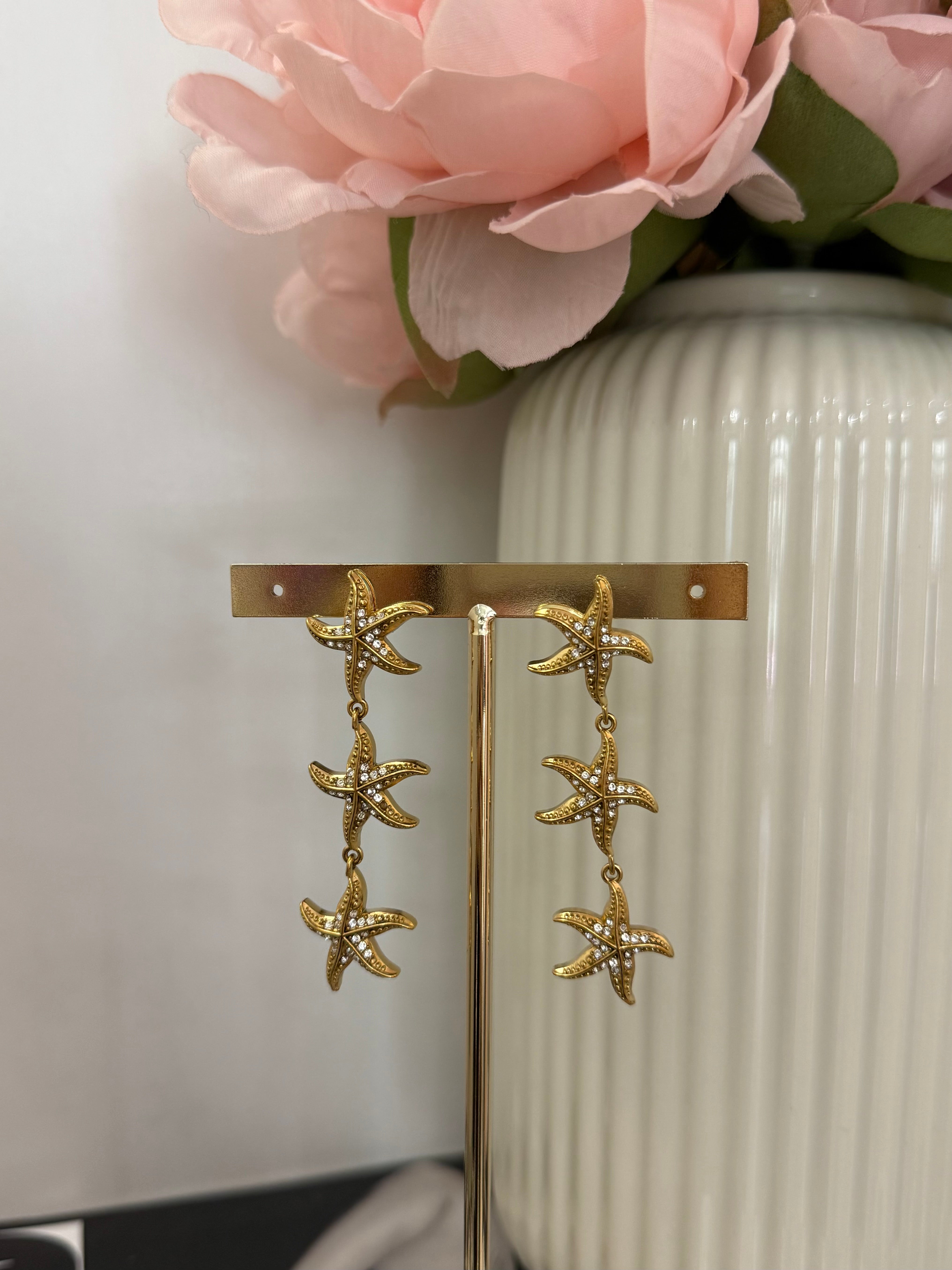 Orecchini pendenti stella marina con strass