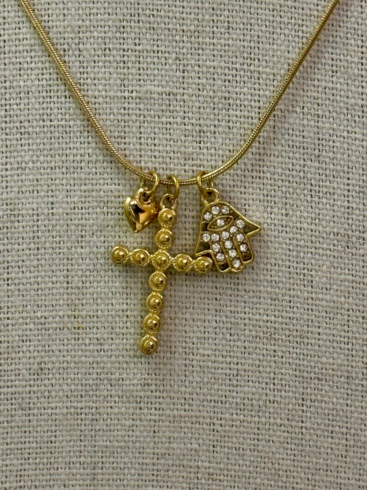 collana multicharm croce e mano di fatima
