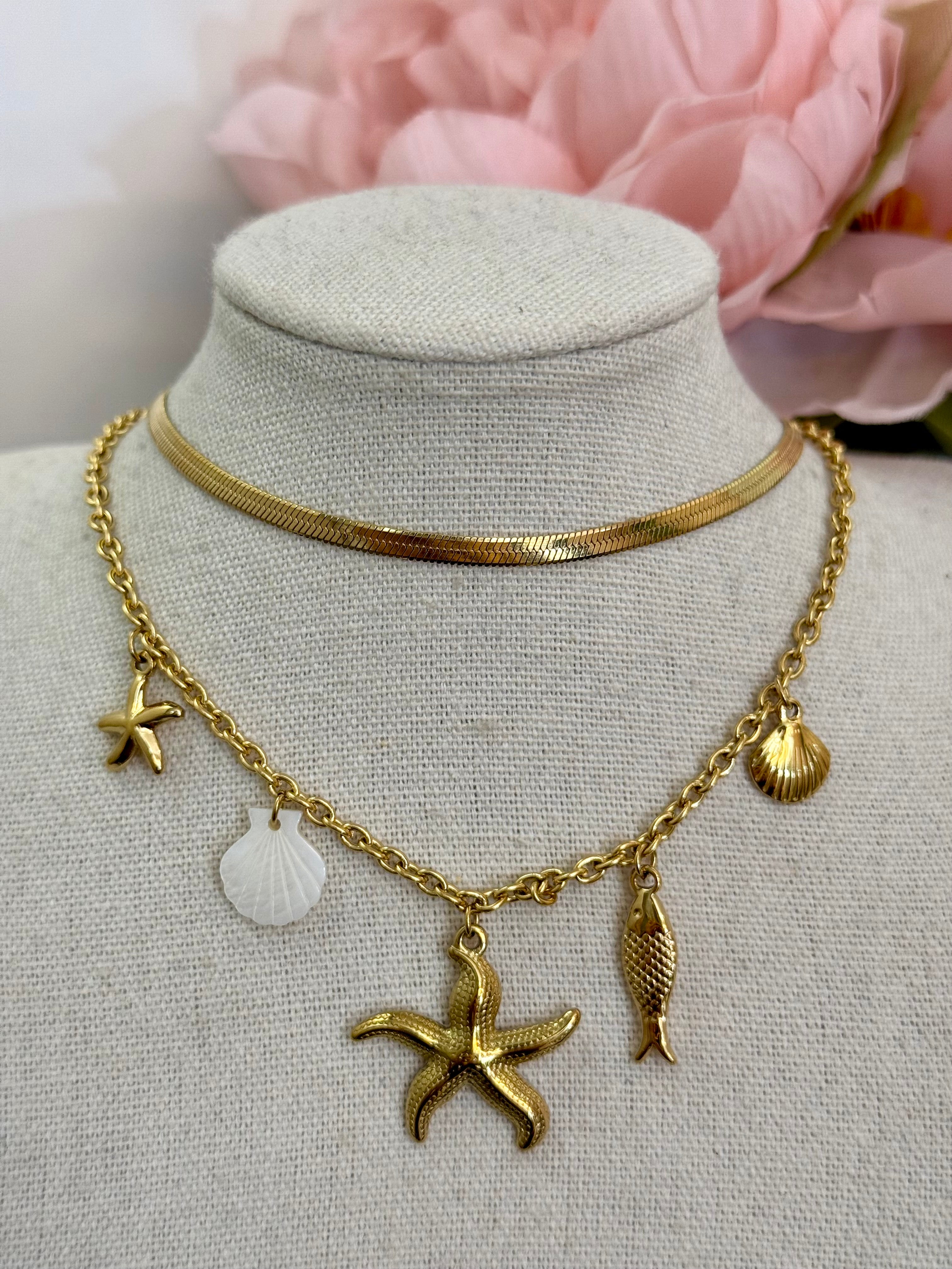 Collana multi charm stella marina e conchiglie