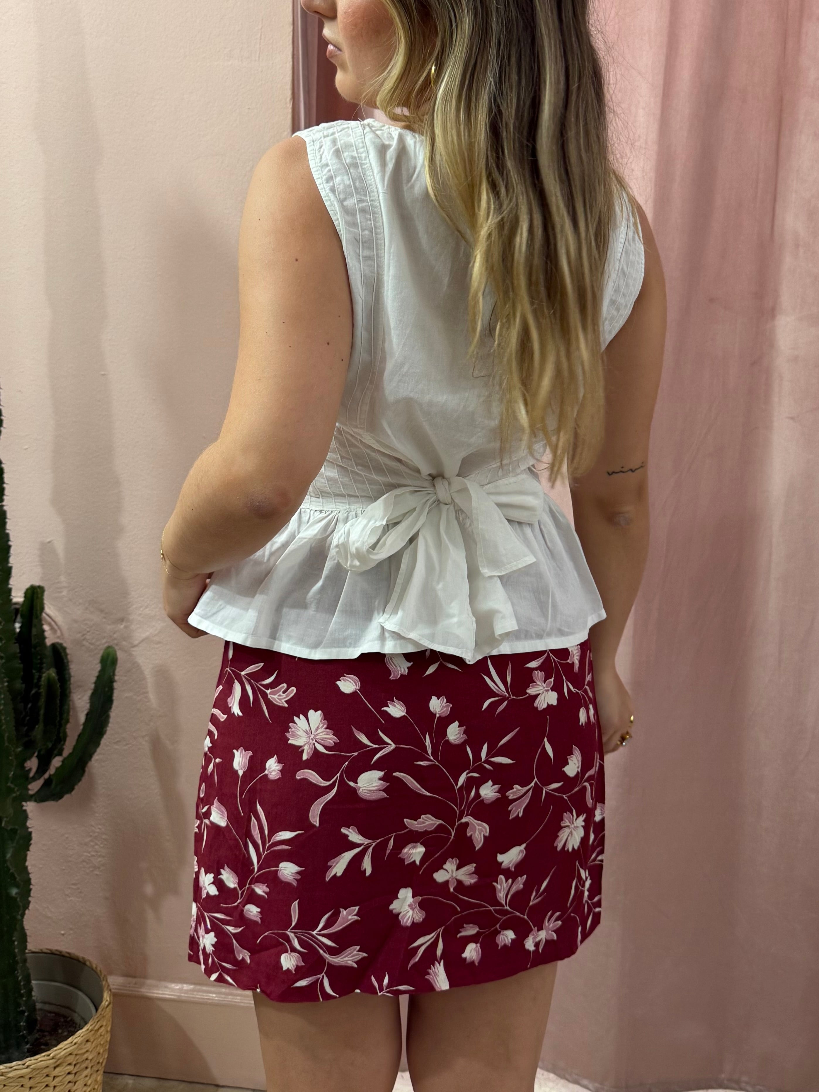 Blusa smanicata bianca in cotone con fiocco