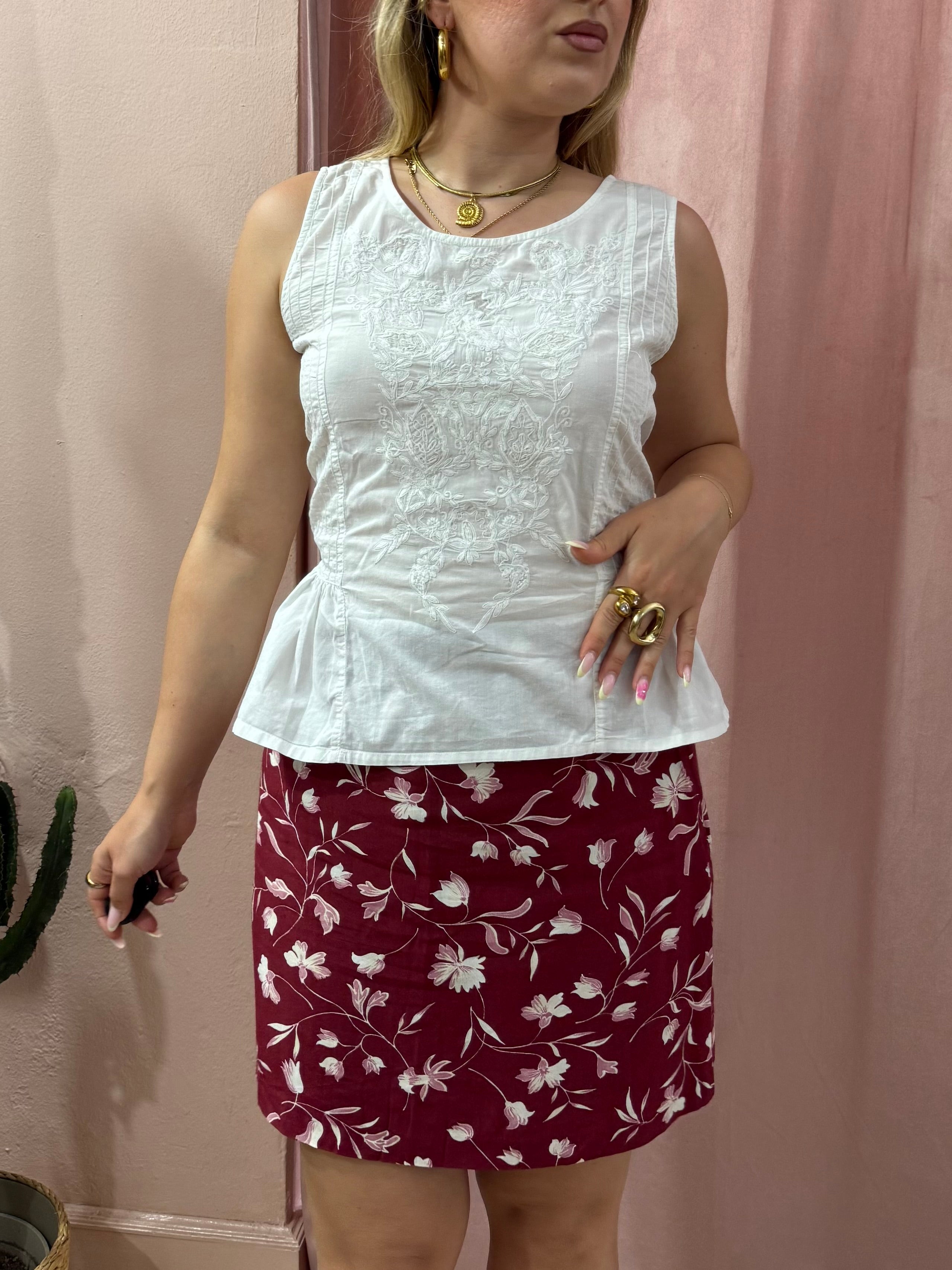 Blusa smanicata bianca in cotone con fiocco