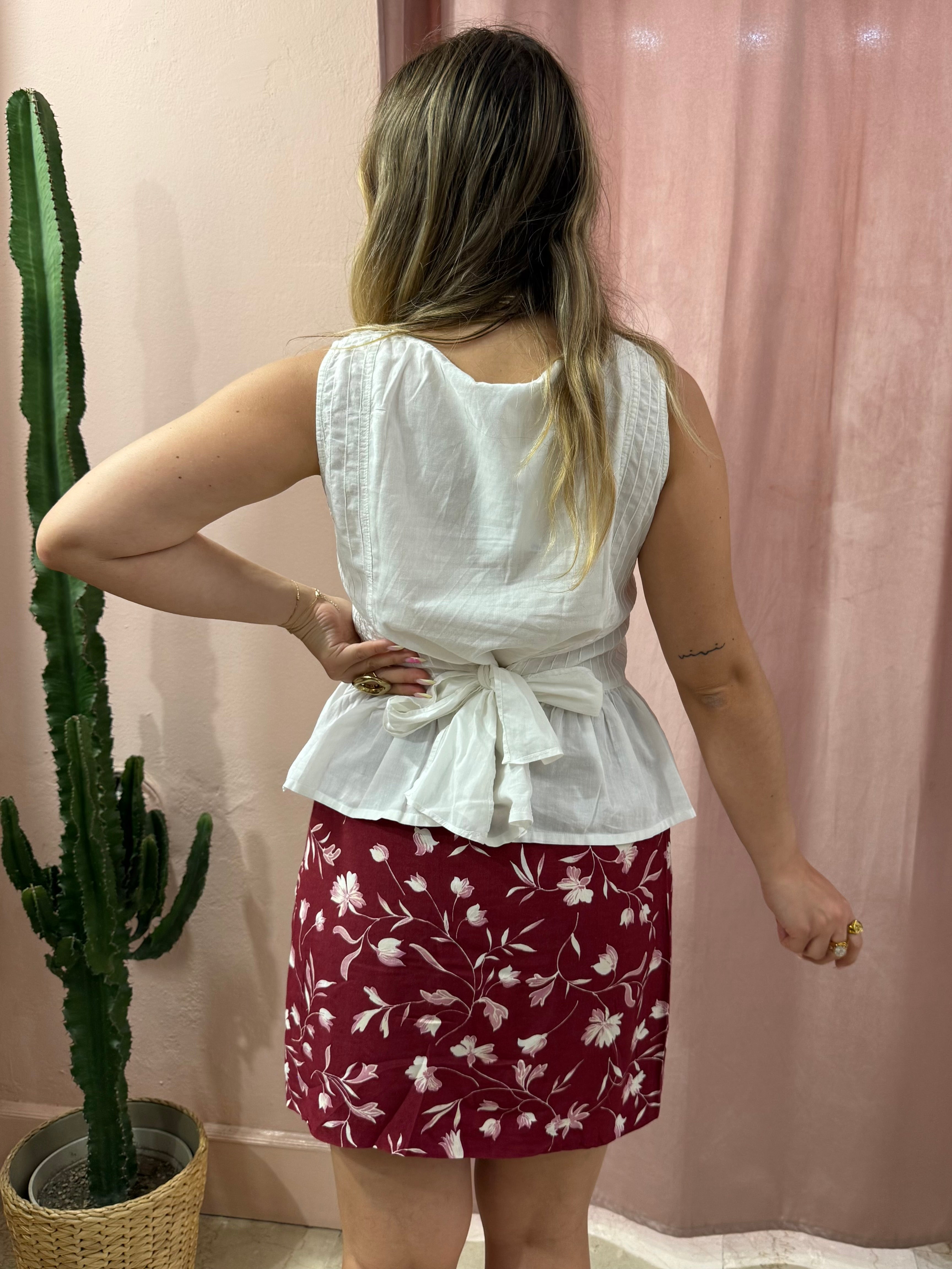 Blusa smanicata bianca in cotone con fiocco
